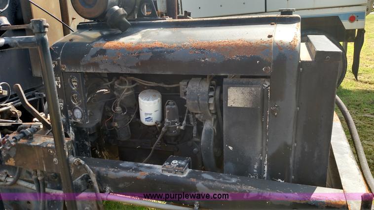 image for item K1021 1985 GMC 7000 oil distributor truck