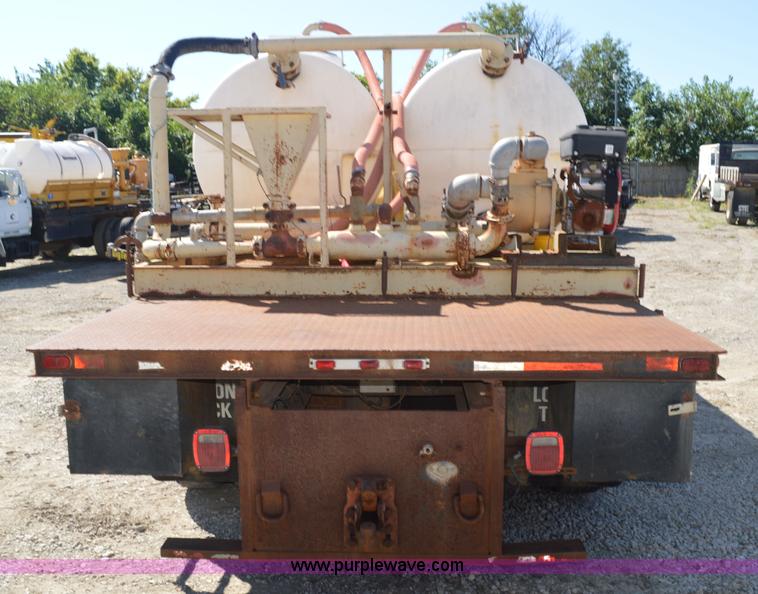 image for item BM9331 1999 Ford F800 flat bed truck with mud mixer