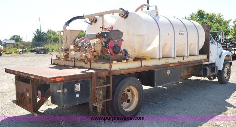 image for item BM9331 1999 Ford F800 flat bed truck with mud mixer