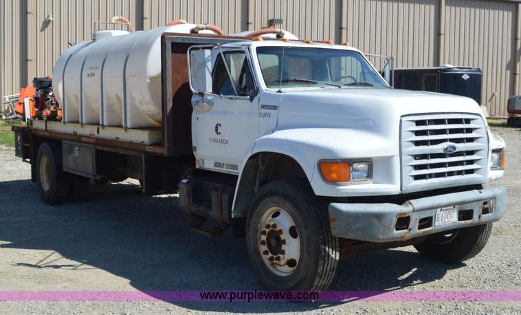 image for item BM9331 1999 Ford F800 flat bed truck with mud mixer