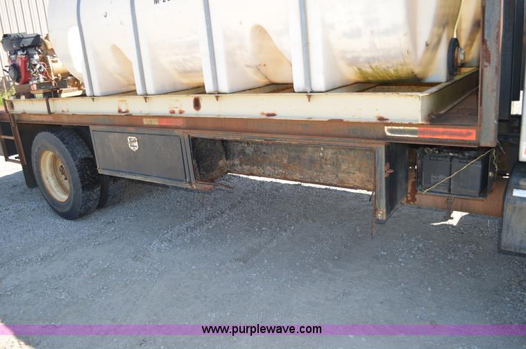 image for item BM9331 1999 Ford F800 flat bed truck with mud mixer