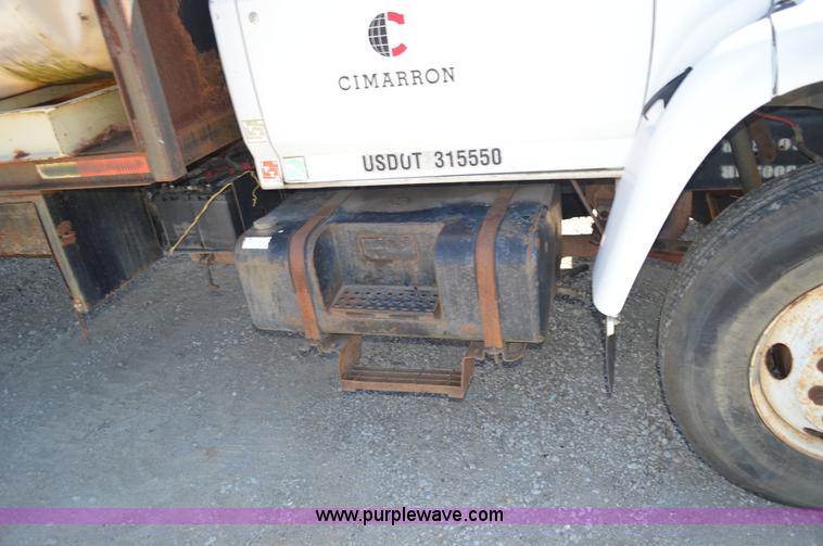 image for item BM9331 1999 Ford F800 flat bed truck with mud mixer