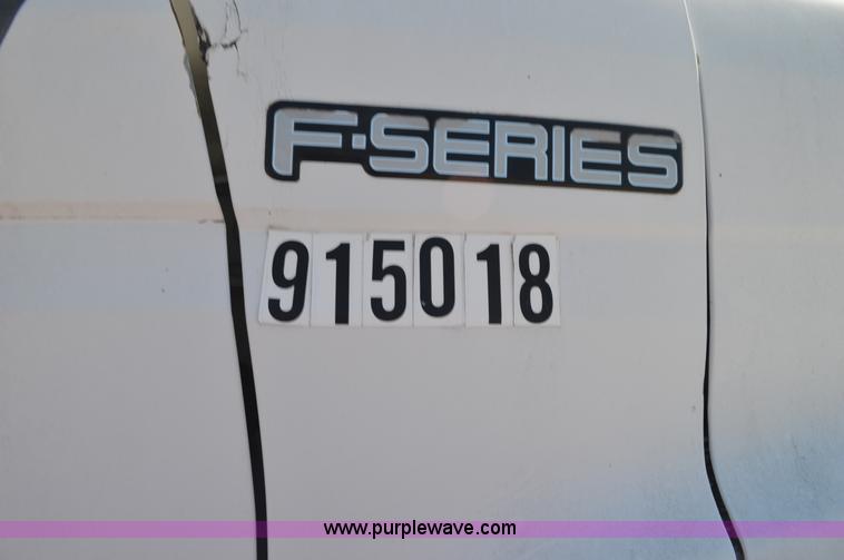 image for item BM9331 1999 Ford F800 flat bed truck with mud mixer