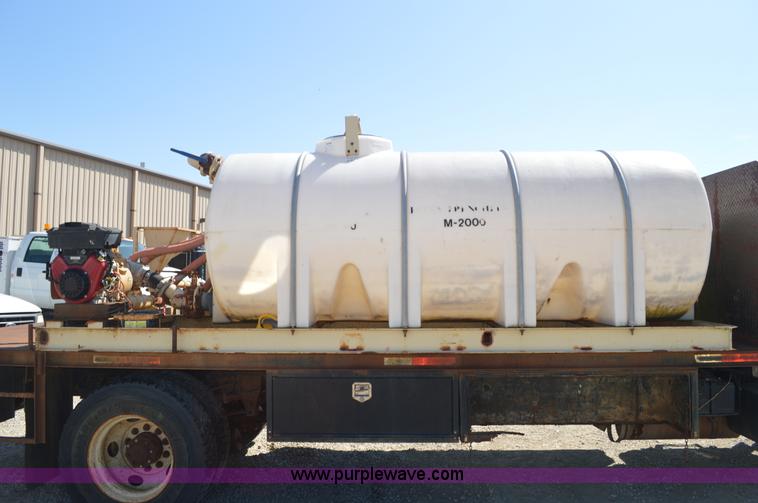 image for item BM9331 1999 Ford F800 flat bed truck with mud mixer