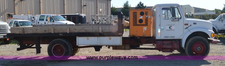 image for item BM9332 1997 International 4700 flat dump bed truck