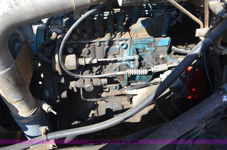 image for item BM9332 1997 International 4700 flat dump bed truck