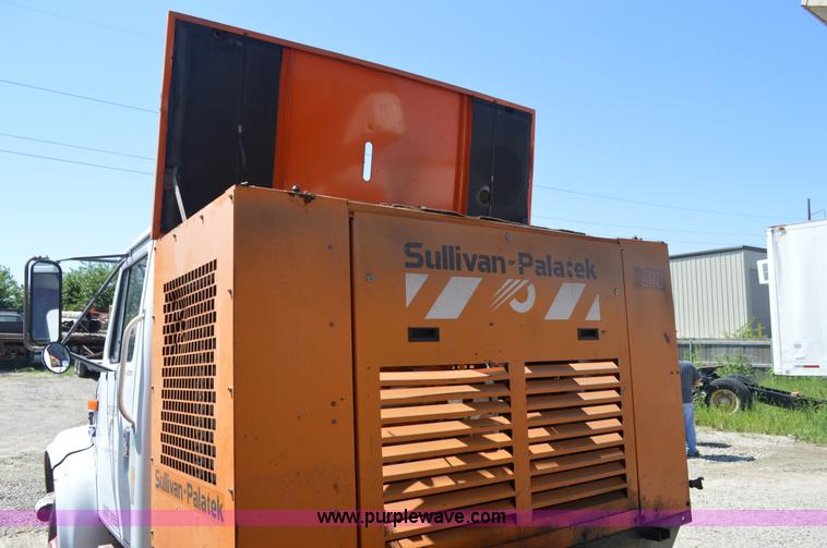 image for item BM9332 1997 International 4700 flat dump bed truck