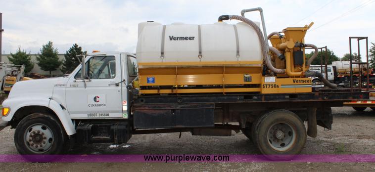 image for item BM9337 1999 Ford F800 flatbed truck with mud mixer