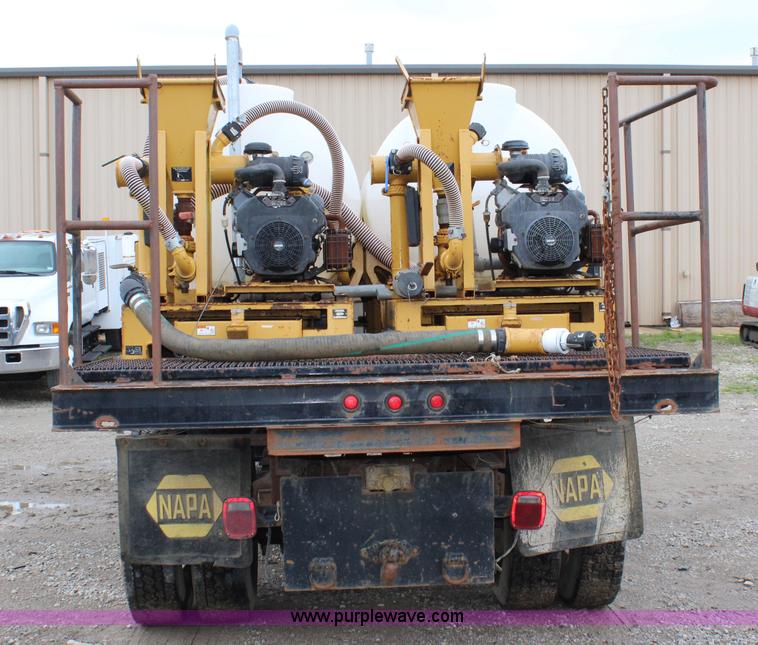 image for item BM9337 1999 Ford F800 flatbed truck with mud mixer