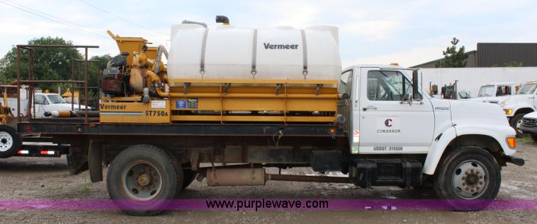 image for item BM9337 1999 Ford F800 flatbed truck with mud mixer