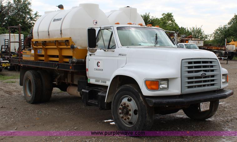 image for item BM9337 1999 Ford F800 flatbed truck with mud mixer