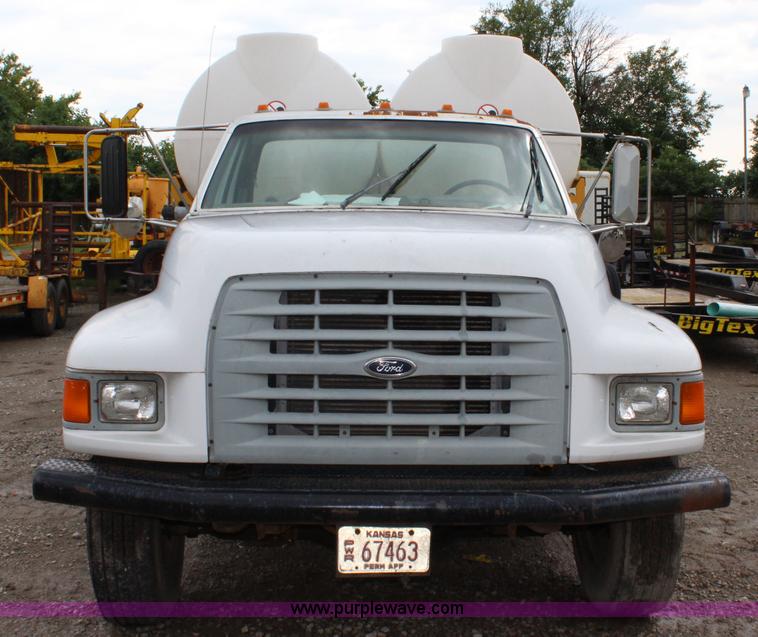 image for item BM9337 1999 Ford F800 flatbed truck with mud mixer