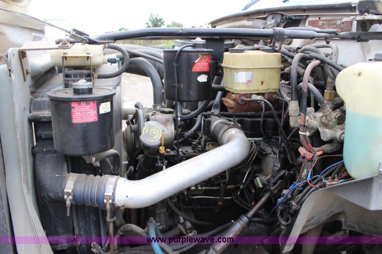 image for item BM9337 1999 Ford F800 flatbed truck with mud mixer