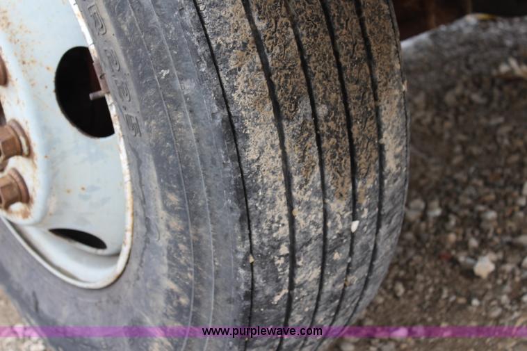 image for item BM9337 1999 Ford F800 flatbed truck with mud mixer