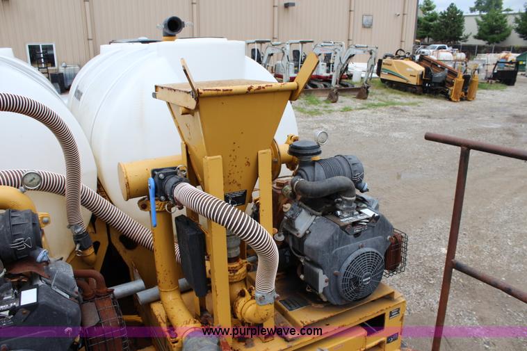 image for item BM9337 1999 Ford F800 flatbed truck with mud mixer