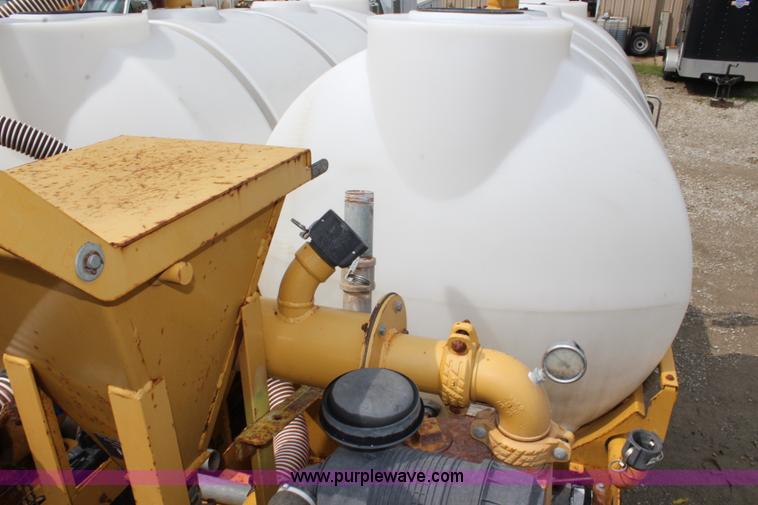 image for item BM9337 1999 Ford F800 flatbed truck with mud mixer