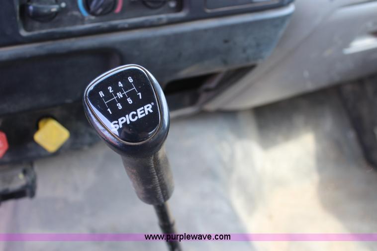 image for item BM9338 2000 Ford F750 flatbed truck with mud mixer