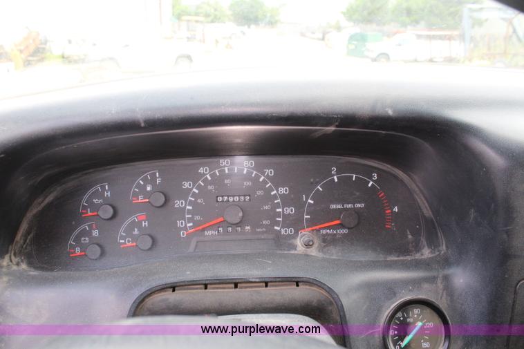 image for item BM9338 2000 Ford F750 flatbed truck with mud mixer