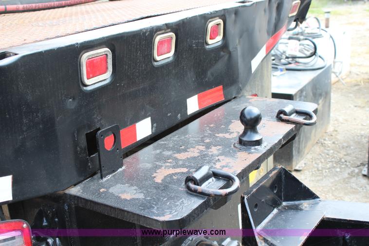 image for item BM9338 2000 Ford F750 flatbed truck with mud mixer