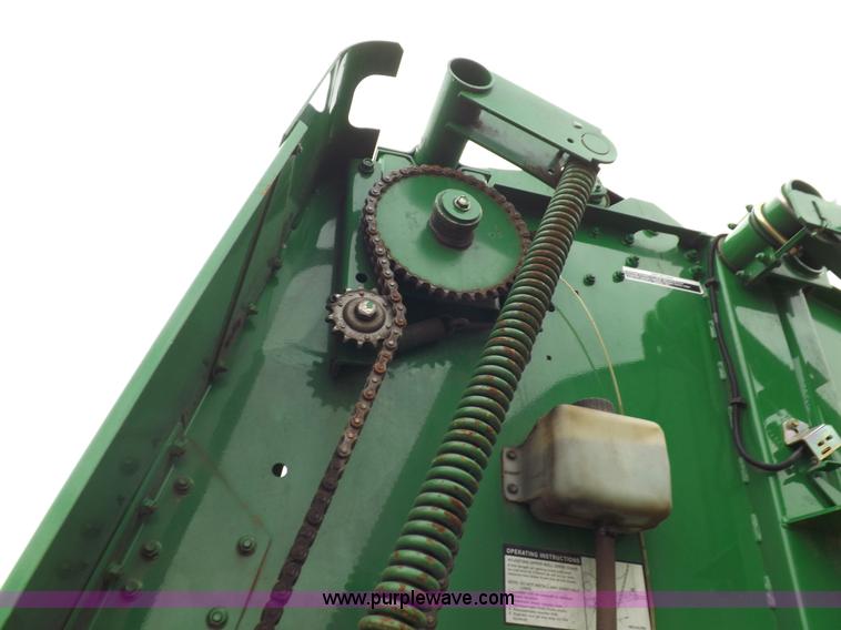 image for item J6869 2003 John Deere 567 Mega Wide round baler