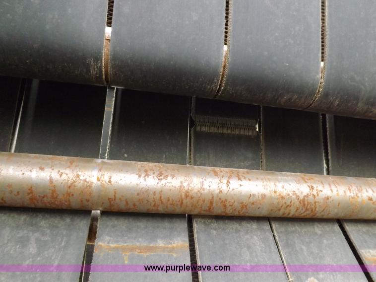 image for item J6869 2003 John Deere 567 Mega Wide round baler