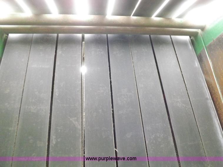 image for item J6869 2003 John Deere 567 Mega Wide round baler