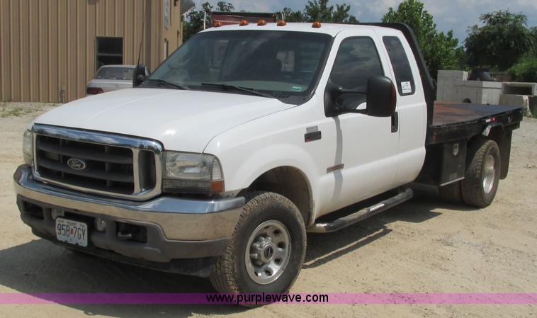 image for item J8577 2003 Ford F350 Super Duty XLT SuperCab flatbed truck