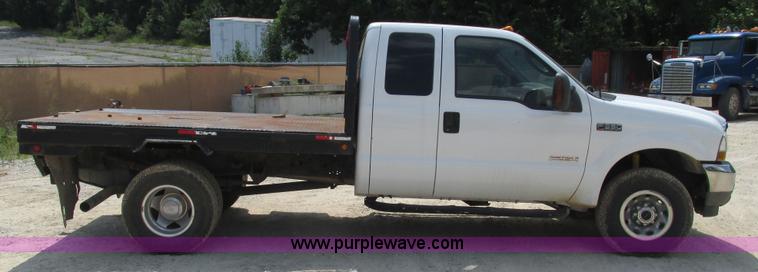 image for item J8577 2003 Ford F350 Super Duty XLT SuperCab flatbed truck