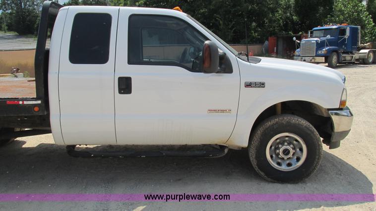 image for item J8577 2003 Ford F350 Super Duty XLT SuperCab flatbed truck