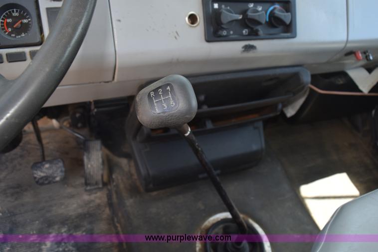 image for item L5779 1997 Freightliner FL70 flatbed truck