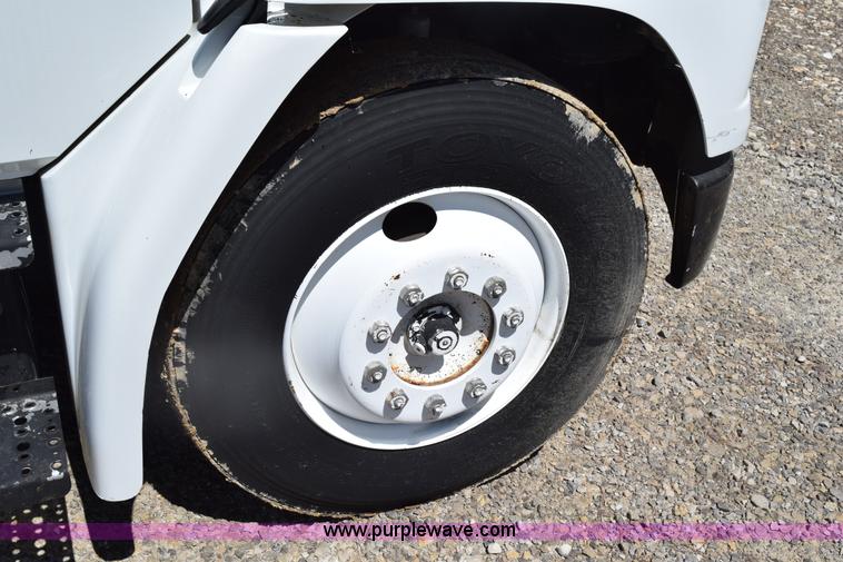 image for item L5779 1997 Freightliner FL70 flatbed truck