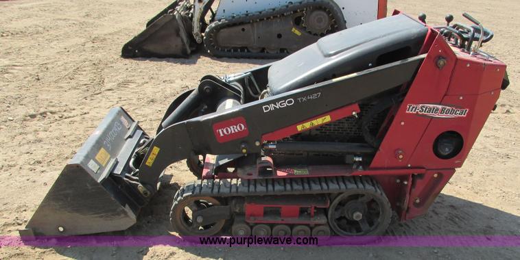 image for item K6562 2014 Toro Dingo TX427 walk behind skid steer