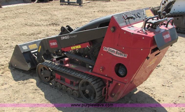 image for item K6562 2014 Toro Dingo TX427 walk behind skid steer