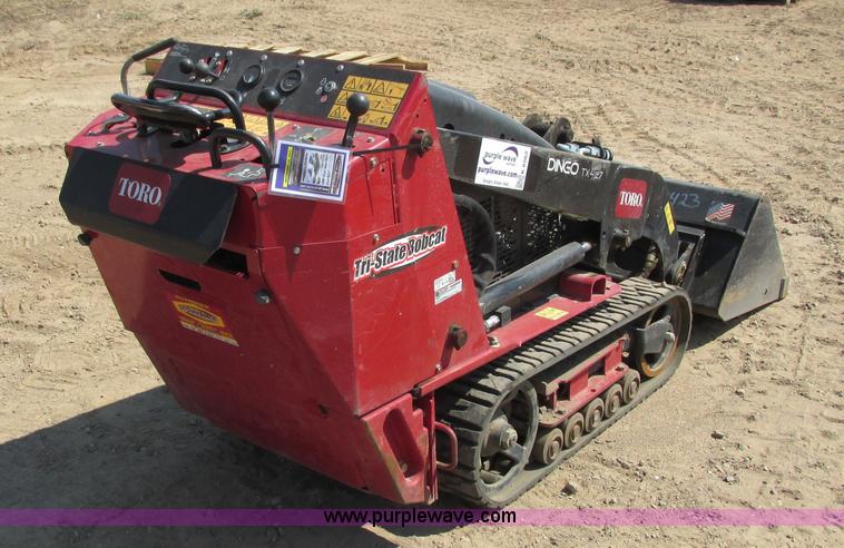 image for item K6562 2014 Toro Dingo TX427 walk behind skid steer
