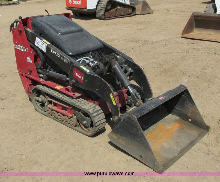 image for item K6562 2014 Toro Dingo TX427 walk behind skid steer