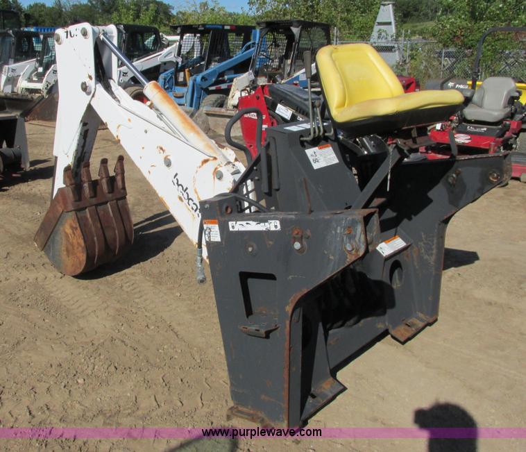 image for item K6611 Bobcat 709 backhoe skid steer attachment