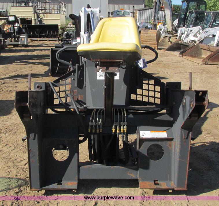 image for item K6611 Bobcat 709 backhoe skid steer attachment