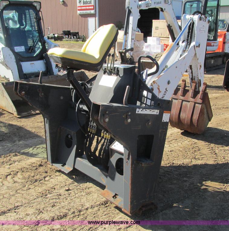 image for item K6611 Bobcat 709 backhoe skid steer attachment