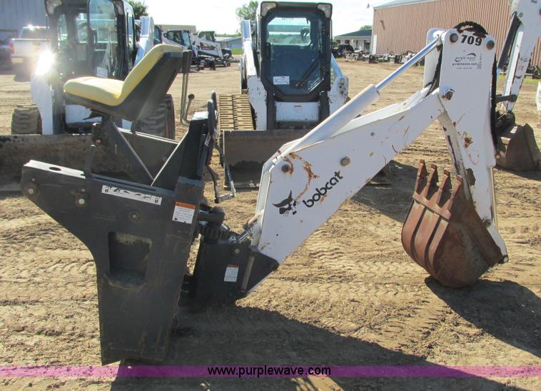 image for item K6611 Bobcat 709 backhoe skid steer attachment