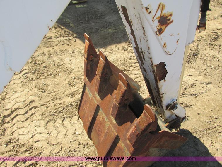 image for item K6611 Bobcat 709 backhoe skid steer attachment