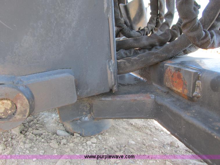 image for item K6611 Bobcat 709 backhoe skid steer attachment