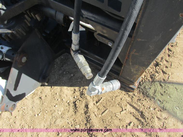 image for item K6611 Bobcat 709 backhoe skid steer attachment