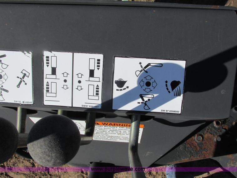 image for item K6611 Bobcat 709 backhoe skid steer attachment