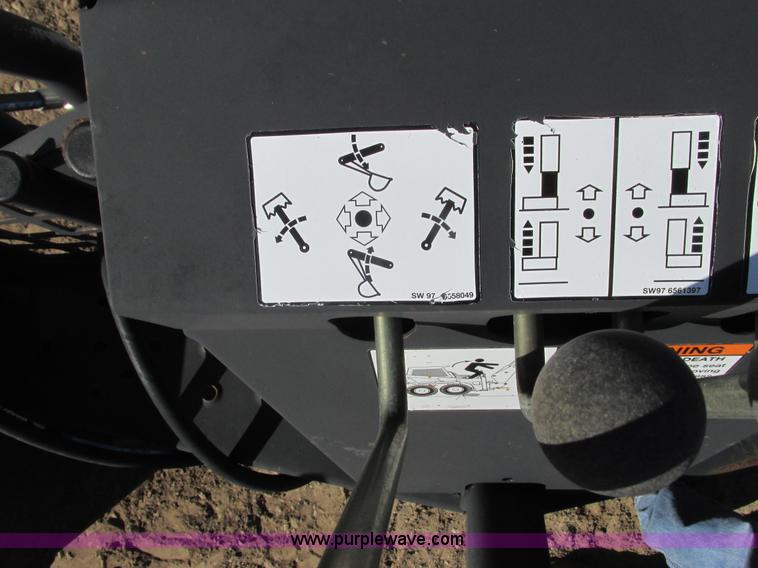 image for item K6611 Bobcat 709 backhoe skid steer attachment