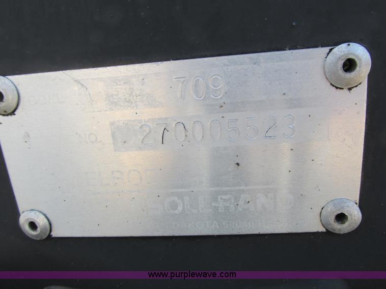 image for item K6611 Bobcat 709 backhoe skid steer attachment