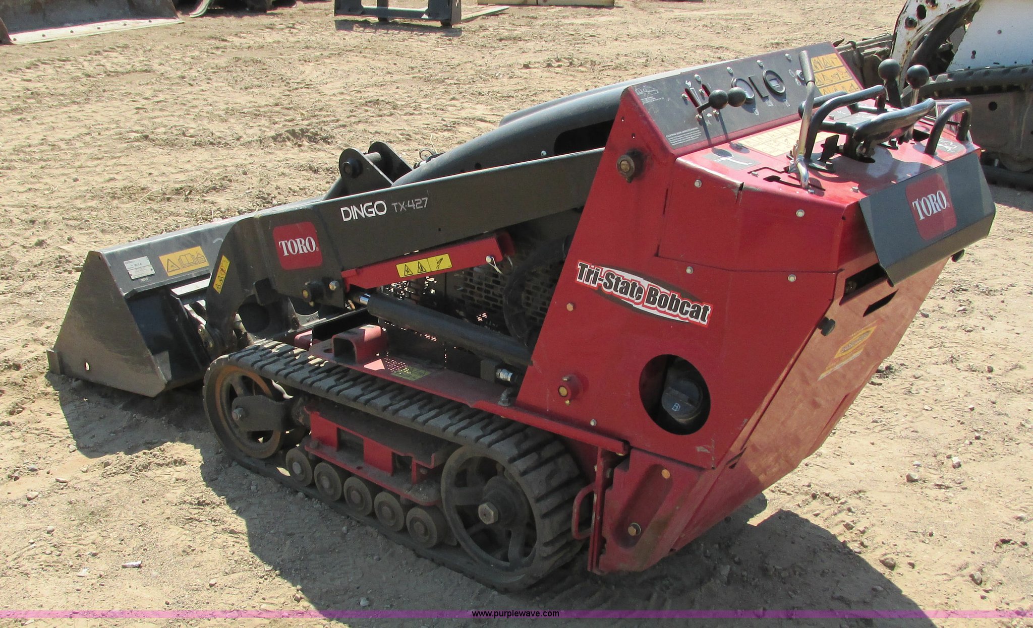 2014 Toro Dingo TX427 walk behind skid steer in Hudson, WI Item K6562