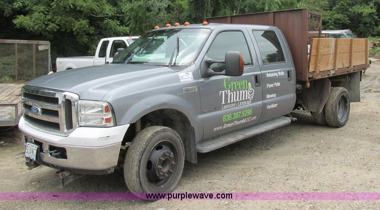 image for item K5102 2002 Ford F450 Super Duty XL Crew Cab dump flat bed truck