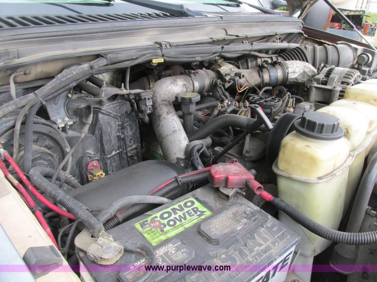 image for item K5102 2002 Ford F450 Super Duty XL Crew Cab dump flat bed truck