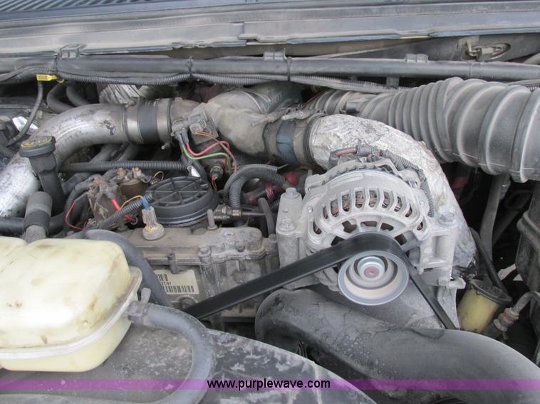 image for item K5102 2002 Ford F450 Super Duty XL Crew Cab dump flat bed truck