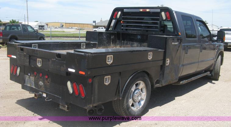 image for item K8652 2010 Ford F350 Super Duty XLT Crew Cab flatbed pickup truck